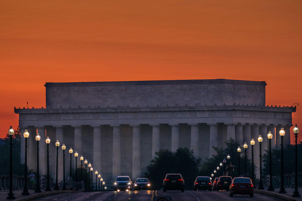 <p>Traffic rolls across the Memorial Bridge toward the Lincoln Memorial at sunrise in Washington, May 20, 2016. Washingtonians are enjoying a brief respite from many days overcast skies and rain. (J. David Ake/AP) </p>
