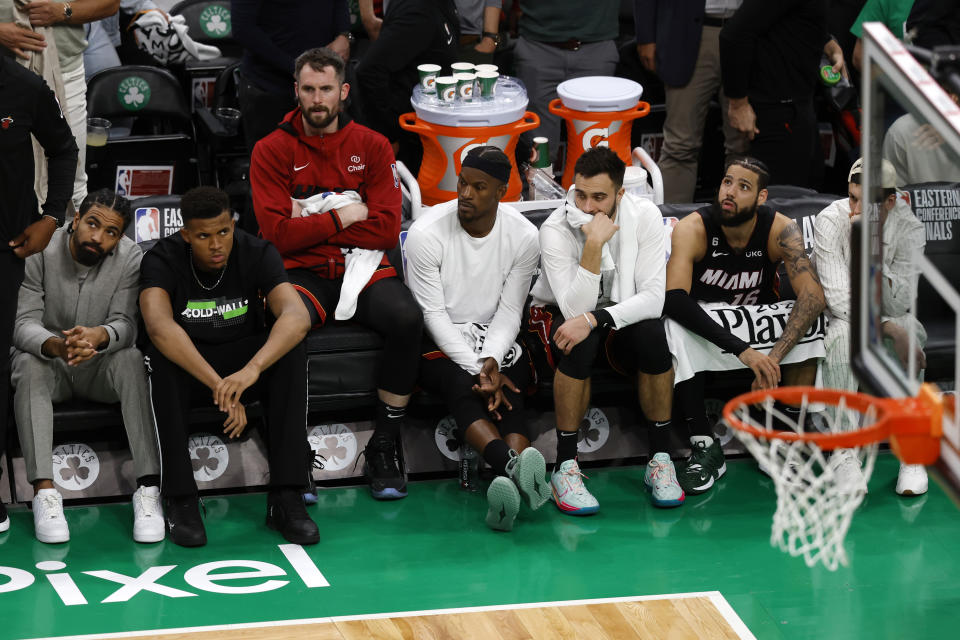 Members of the Miami Heat watch from the bench in the closing seconds in Game 5 of the NBA basketball Eastern Conference finals against the Boston Celtics Thursday, May 25, 2023, in Boston. (AP Photo/Michael Dwyer)