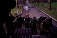 Recruits enter a truck to go on a shooting range during their 16-day basic training for Poland's Territorial Defence Forces, at a military unit in Siedlce, Poland, December 8, 2017. REUTERS/Kacper Pempel/Files