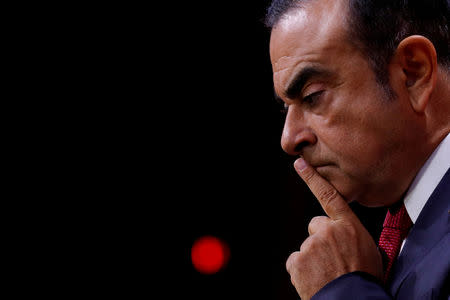 FILE PHOTO - Carlos Ghosn, Chairman and CEO of the Renault-Nissan Alliance, reacts during a news conference in Paris, France, September 15, 2017. REUTERS/Philippe Wojazer/File Photo