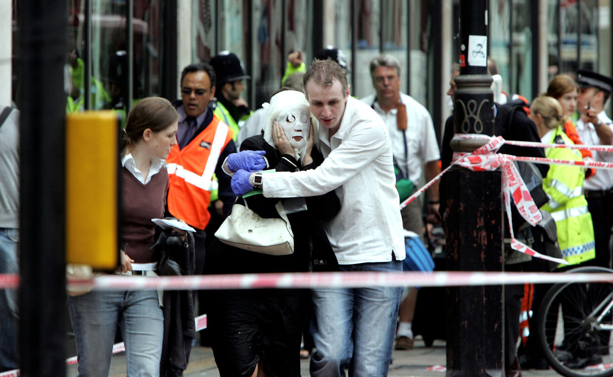 LONDON - JULY 7:  Emergency services assist evacuated passengers at Edgware Road following an explosion which has ripped through London's underground tube network on July 7, 2005 in London, England. Blasts have been reported on the underground network and buses across the capital. (Photo by Gareth Cattermole/Getty Images)