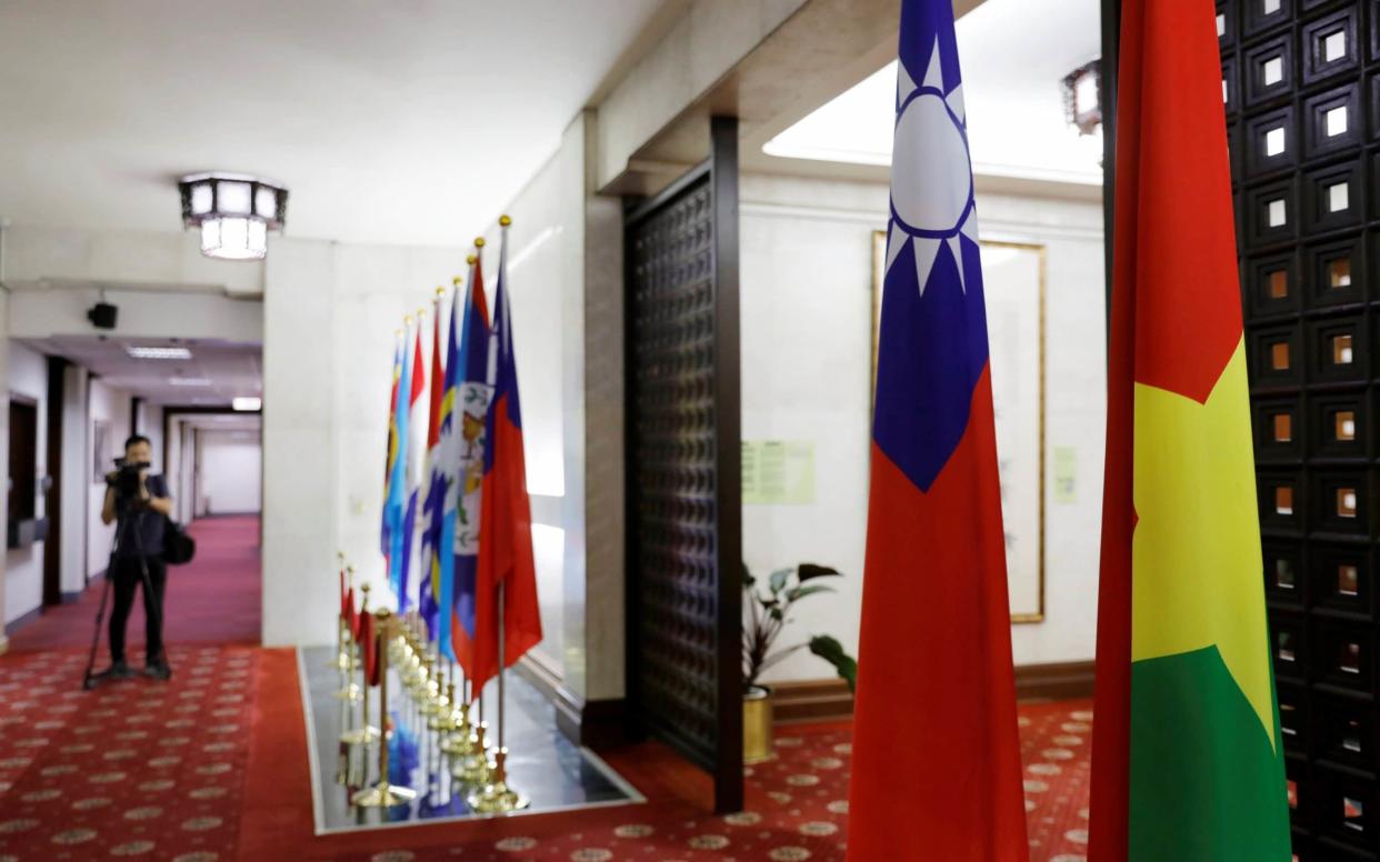 Flags of Taiwan (2nd-R) and Burkina Faso (R) are seen inside the Taiwan's Ministry of Foreign Affairs in Taipei - REUTERS