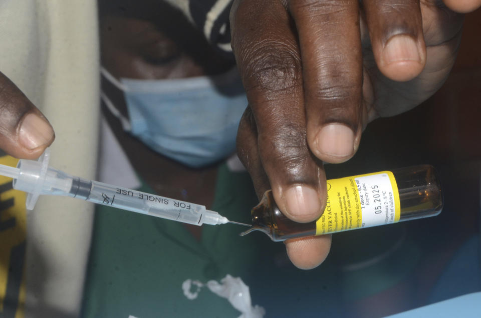 A nurse prepares to administer yellow fever vaccine at Kiswa Health Center III in Kampala, Uganda Tuesday, April 2, 2024. Uganda has rolled out a nationwide yellow fever vaccination campaign to help safeguard its population against the mosquito-borne disease that has long posed a threat. (AP Photo)