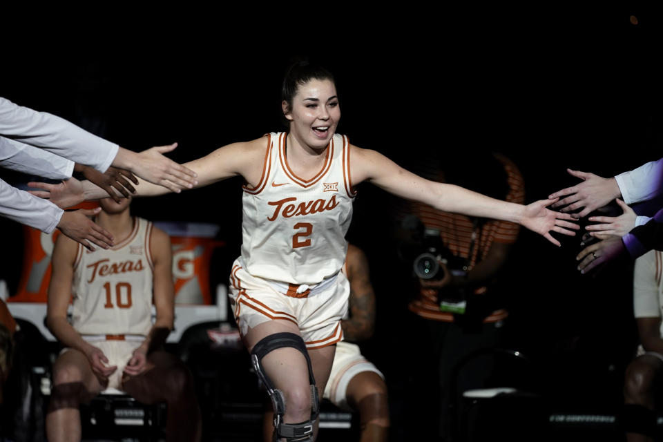 Texas guard Shaylee Gonzales is introduced before an NCAA college basketball game against Kansas State in the the Big 12 Conference tournament Friday, March 10, 2023, in Kansas City, Mo. The Texas guard has 206,000 Tik Tok followers and 93,000 more on Instagram. Her posts are a mix of basketball, fashion, personal life and products she has NIL deals with. (AP Photo/Charlie Riedel)