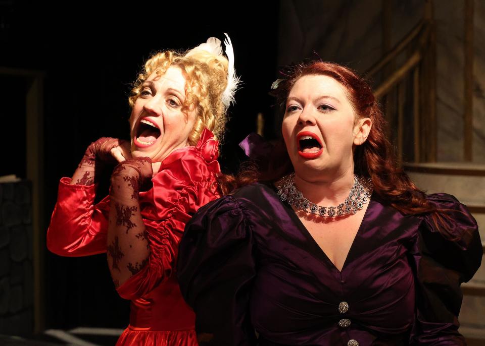 Dimwitted stepsisters Joy (Missy Potash) and Portia (Erica Morris) voice their opinions in "Cinderella" at the Academy of Performing Arts in Orleans through Dec. 23.