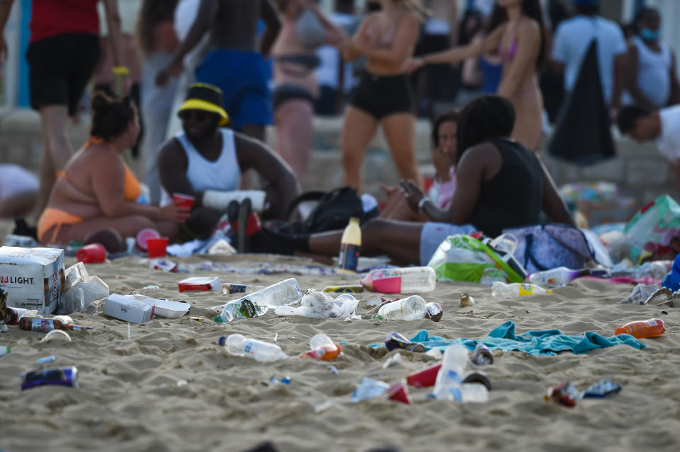 Plastic bottles, cardboard beer crates, bags and takeaway packaging were strewn across Bournemouth Beach on Thursday afternoon. (Getty)