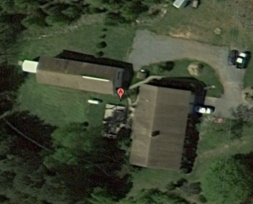 Satellite view of a building with a red marker labeled "A" near its entrance