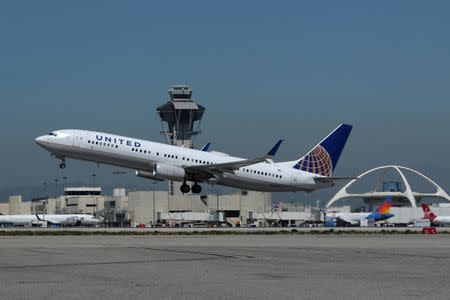 FILE PHOTO: A United Airlines Boeing 737-900ER plane takes off from Los Angeles International airport (LAX) in Los Angeles, California, U.S. March 28, 2018. REUTERS/Mike Blake/File Photo