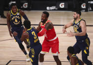 Indiana Pacers guard Aaron Holiday (3) steals the ball from Houston Rockets forward Jeff Green (32) in the first half of an NBA basketball game Wednesday, Aug. 12, 2020, in Lake Buena Vista, Fla. (Kim Klement/Pool Photo via AP)