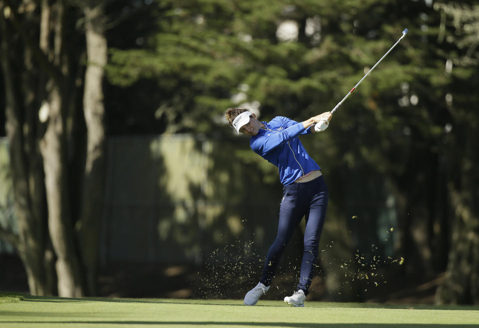Anne Van Dam, of the Netherlands, hits her approach shot to the 18th green of the Lake Merced Golf Club during the first round of the LPGA Mediheal Championship golf tournament Thursday, May 2, 2019, in Daly City, Calif. (AP Photo/Eric Risberg)