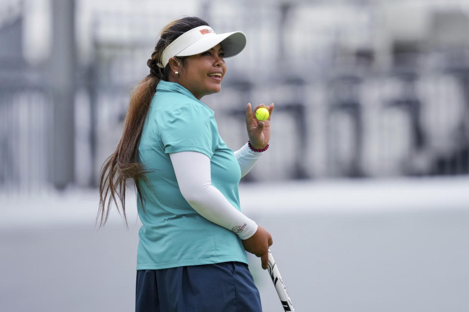 Dottie Ardina, of the Philippines, reacts after making a putt on the 18th green during the first round of the LPGA Kroger Queen City Championship golf tournament in Cincinnati, Thursday, Sept. 7, 2023. (AP Photo/Aaron Doster)