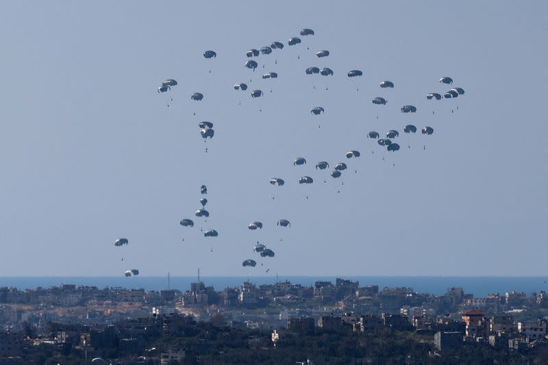 FILE PHOTO: Packages fall towards northern Gaza