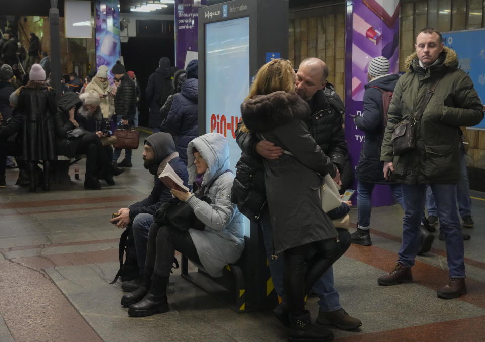 People rest in a subway station, being used as a bomb shelter during a rocket attack in Kyiv, Ukraine, Friday, Dec. 16, 2022. Ukrainian authorities reported explosions in at least three cities Friday, saying Russia has launched a major missile attack on energy facilities and infrastructure. Kyiv Mayor Vitali Klitschko reported explosions in at least four districts, urging residents to go to shelters. (AP Photo/Efrem Lukatsky)