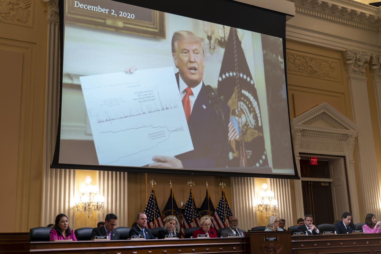 Then-President Donald Trump, holding up a chart that he said backed his claims of a stolen election, is displayed on a video screen during a Jan. 6 committee hearing on Monday. 