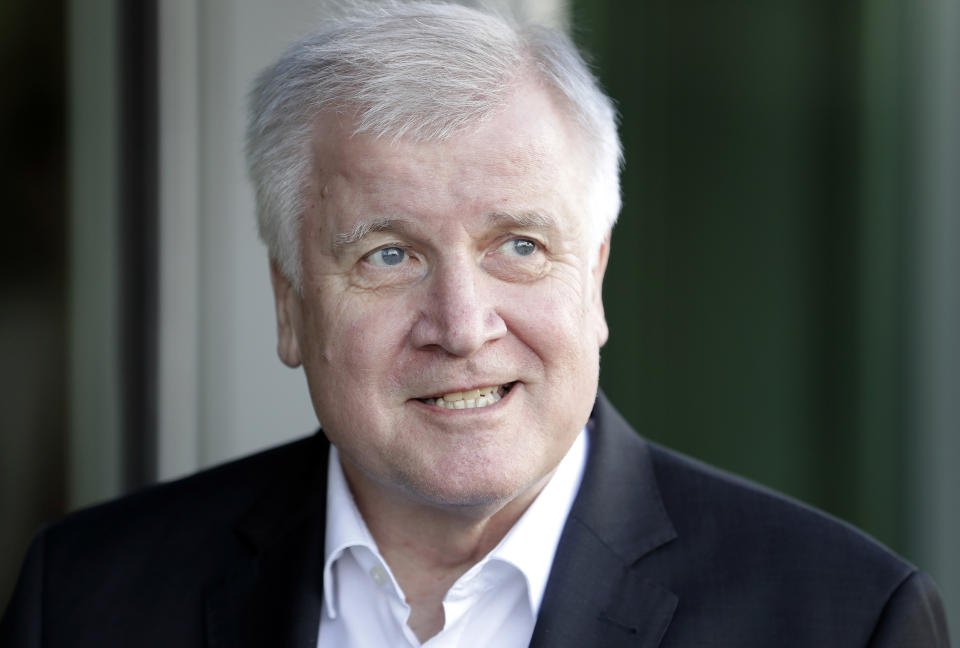 File---Picture taken July 2, 2018 shows German Interior Minister and chairman of the German Christian Social Union (CDU), Horst Seehofer, speaking as he arrives for a meeting with German Chancellor and chairwoman of the German Christian Democratic Union (CDU), Angela Merkel, in Berlin, Germany. (AP Photo/Michael Sohn)