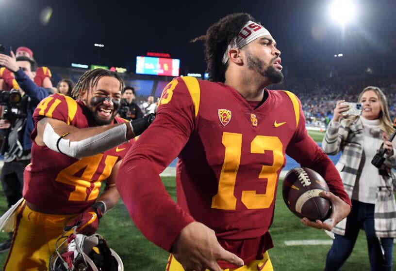 Pasadena, California November 19, 2022- USC quarterback Caleb Williams celebrates the teams win over UCLA at the Rose Bowl Saturday. (Wally Skalij/Los Angeles Times)