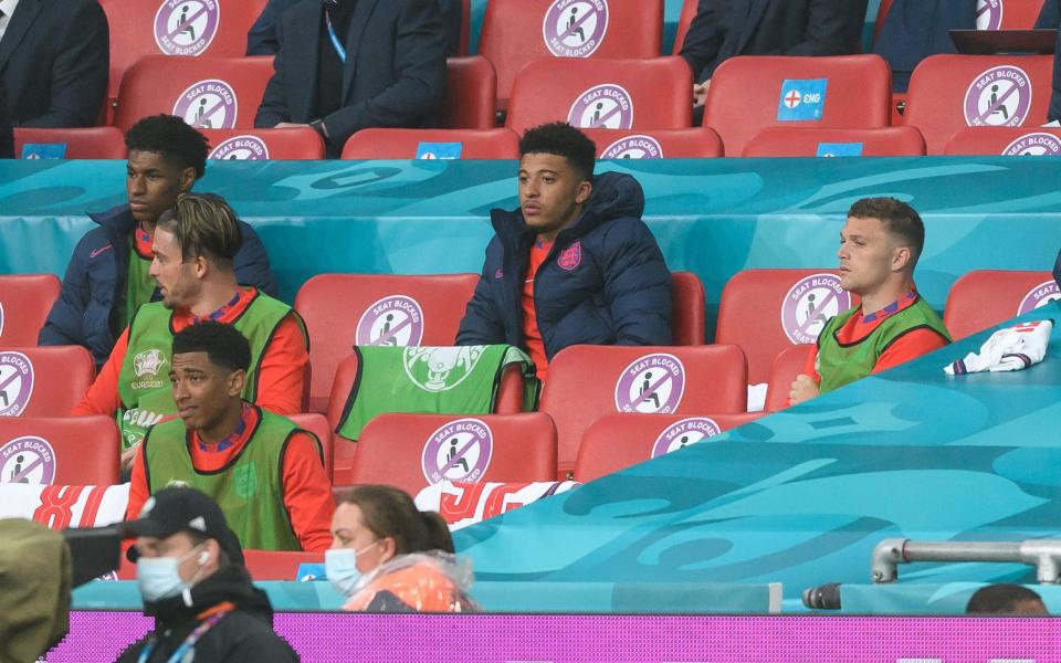 Jadon Sancho (centre) is an unused substitute against Scotland - GETTY IMAGES