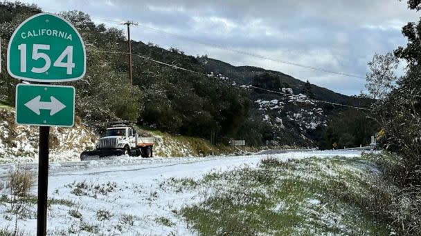 PHOTO: In this photo provided by the Santa Barbara County Fire Department, a snow plow clears snow near the 2,200 ft summit of San Marcos Pass along Highway 154 in Santa Barbara County, Calif., Feb. 23, 2023. (Mike Eliason/AP)