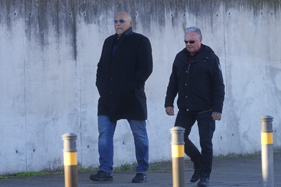 Leader of a Hells Angels gang, German national Frank Hanebuth, left, arrives at the National Court in San Fernando de Henares, just outside Madrid, Spain, Monday, Jan. 23, 2023. A European leader of the Hells Angels goes on trial in Madrid for running a chapter of the criminal biker gang on the Spanish holiday island of Mallorca. Prosecutors are seeking a 13-year sentence for German national Frank Hanebuth on charges that include running a criminal organization, money laundering and illegal possession of firearms. He is being tried alongside 46 collaborators from Luxembourg, Turkey and the United Kingdom, the most senior of whom face up to 24 years in jail. (AP Photo/Paul White)