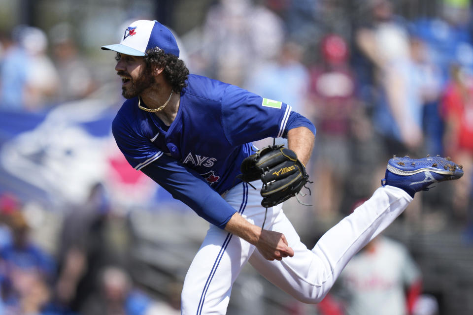 Toronto Blue Jays relief pitcher Jordan Romano (68) throws during the fourt inning of a spring training baseball game against the Philadelphia Phillies Monday, March 4, 2024, in Dunedin, Fla. (AP Photo/Charlie Neibergall)