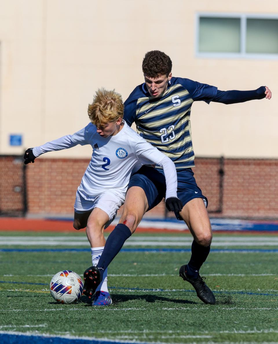 Salesianum’s Jake Ross gets tied up with Charter of Wilmington’s Davin Lysik during the Sals’ 4-1 win over Charter School of Wilmington in the DIAA Division I Boys Soccer championship game Saturday, November 19, 2022 at Dover High School.