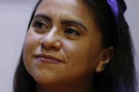 Olimpia Coral Melo, who became an activist against online sexual harassment and assault after a video of her having sex was published online in 2013, smiles during a talk hosted by the Benito Juarez borough of Mexico City, Monday, Nov. 23, 2020. Melo's story and subsequent activism have led to the creation of numerous state laws against cyber violence, and Mexico's government is on the verge of passing a federal version of "Olimpia's Law." (AP Photo/Rebecca Blackwell)