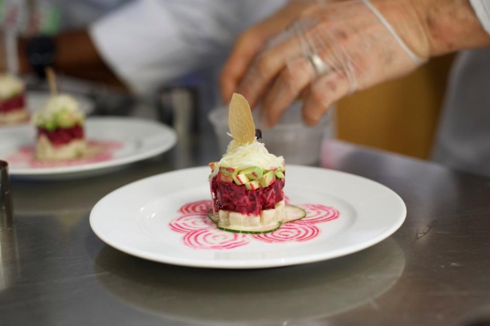 The competing chefs were tasked with cooking delicious meals they might serve to patients. They had 90 minutes to create an appetizer using rainbow beets, an entree with wild monkfish and a dessert with dried prunes. Pictured here is Plainview and Syosset Hospitals Executive chef Marc Bauer’s rainbow beet salad with avocado and jicama appetizer. Tamara Beckwith