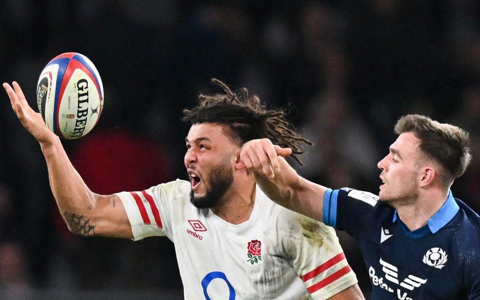 England's Lewis Ludlam fights for the ball Scotland's fly-half Ben White - Glyn Kirk/Getty Images