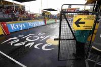 An official stands at the door of the anti-doping medical testing facility near the finish line of the 195-km (121.16 miles) 12th stage of the 102nd Tour de France cycling race from Lannemezan to Plateau De Beille in the French Pyrenees mountains, France, July 16, 2015. REUTERS/Eric Gaillard