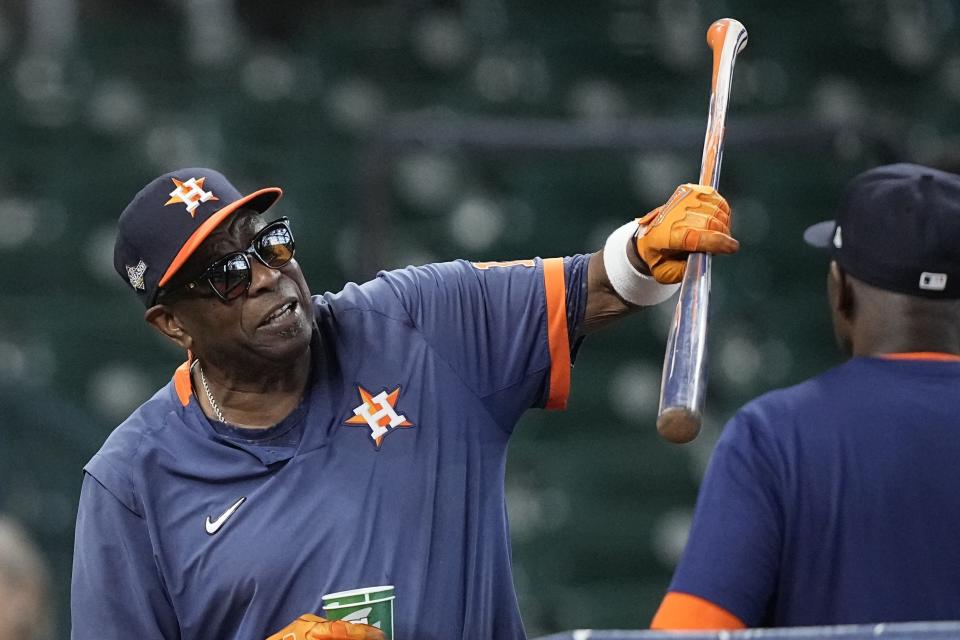 FILE - Houston Astros manager Dusty Baker, left, attends batting practice before Game 6 of the baseball AL Championship Series against the Texas Rangers, Oct. 23, 2023, in Houston. Baker is returning to the San Francisco Giants for a third stint with the team, this time as a special assistant in the front office, according to a person with direct knowledge of the hiring. The person spoke on condition of anonymity because Baker's new position with the club had not been formally announced. (AP Photo/David J. Phillip, File)