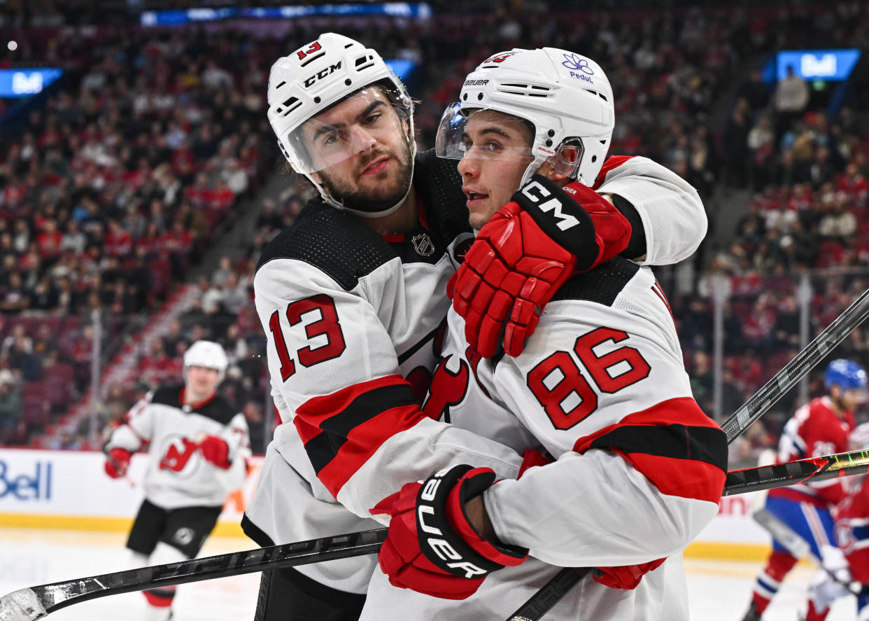 Nico Hischier (L) celebrates his goal with Jack Hughes. (Minas Panagiotakis/Getty Images)