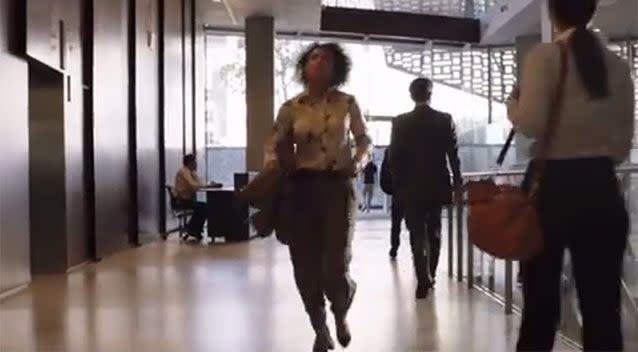 A woman races to get in the lift. Source: YouTube