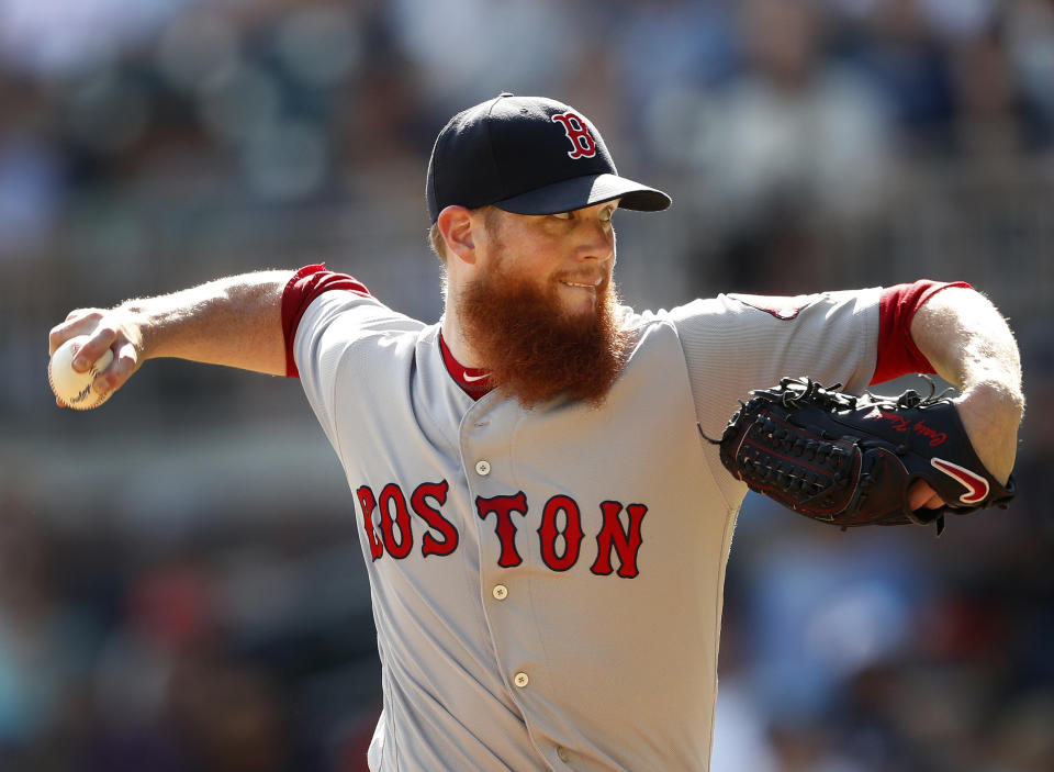 FILE - In this Sept. 3, 2018, file photo, Boston Red Sox relief pitcher Craig Kimbrel works against the Atlanta Braves in the ninth inning of baseball game, in Atlanta. Pitchers Dallas Keuchel and Craig Kimbrel, the last two top free agents on the market, can sign starting Monday, June 3, 2019, with their new teams having to forfeit amateur draft picks as compensation. Both turned down $17.9 million qualifying offers in November, Keuchel from Houston and Kimbrel from the World Series champion Boston Red Sox. (AP Photo/John Bazemore, File)