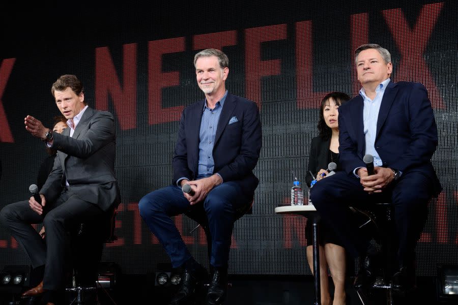 From left, Netflix’s Greg Peters, Reed Hastings and Ted Sarandos at a news conference in Japan in 2016.
