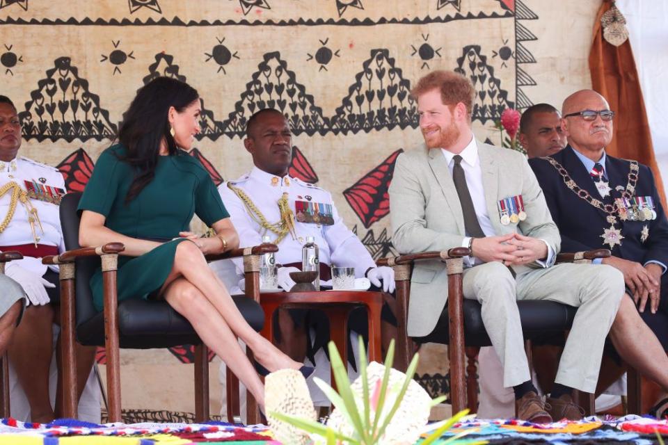 Harry and Meghan smile at one another at the unveiling of a statue in Nadi.