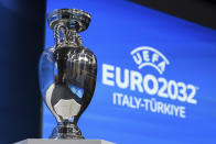 The UEFA Euro trophy is pictured after Italy and Turkey were elected to host the Euro 2032 fooball tournament during the the UEFA EURO 2028 and 2032 hosts announcement ceremony after the UEFA Executive Committee, at UEFA Headquarters, in Nyon, Switzerland, Tuesday, October 10, 2023. UEFA has decided the future of soccer’s European Championship for the next decade. The United Kingdom and Ireland will host in 2028 and an unusual Italy-Turkey co-hosting plan was picked for 2032. (Jean-Christophe Bott/Keystone via AP)