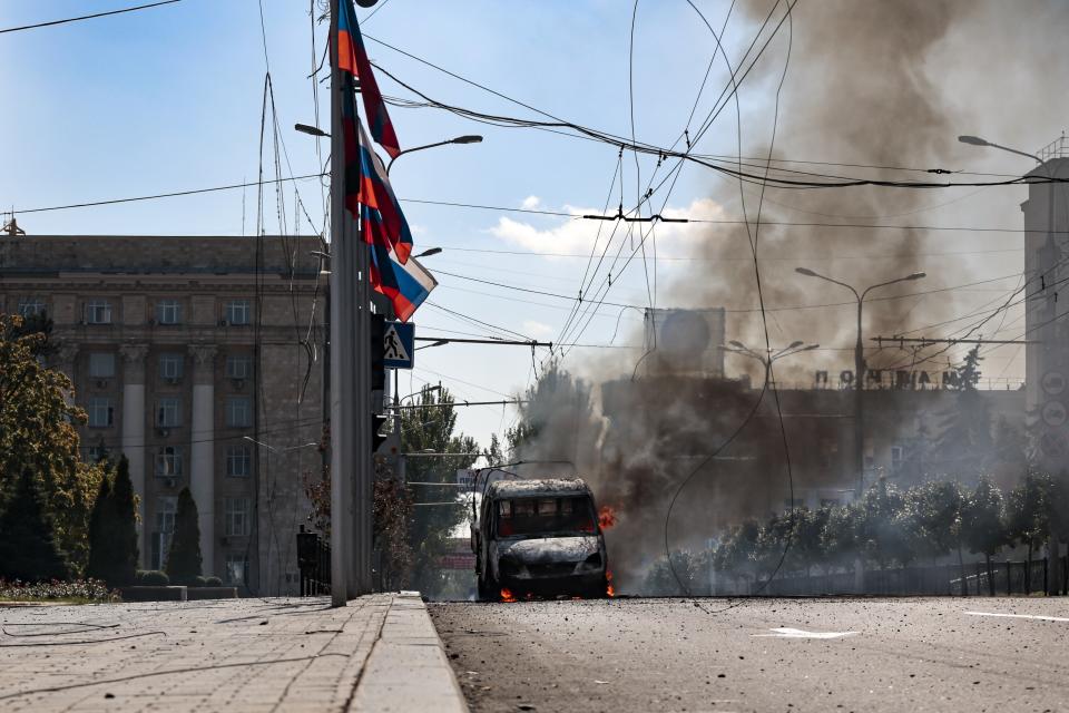 A vehicle on fire after shelling in Donetsk, area controlled by Russian-backed separatist forces, eastern Ukraine, Saturday, Sept. 17, 2022. A Ukrainian shelling attack killed four people in downtown Donetsk on Saturday. According to the city's Mayor Alexey Kulemzin, fragments of munitions for Caesar howitzers were found. (AP Photo/Alexei Alexandrov)