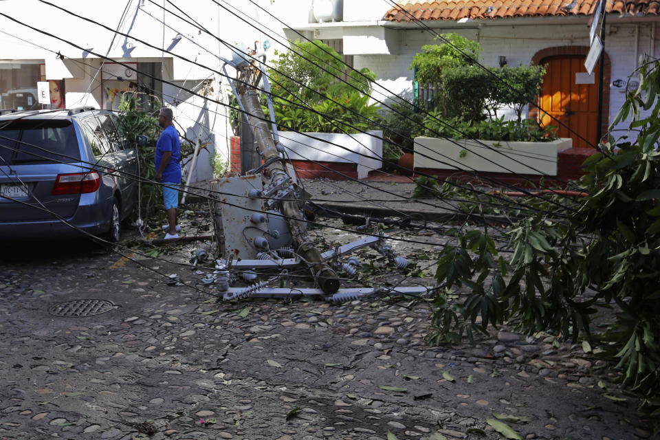 An electricity pole lays on the street after the passing of Hurricane Lidia in Puerto Vallarta, Mexico, Wednesday, Oct. 11, 2023. Lidia dissipated Wednesday after hitting land as a Category 4 hurricane. (AP Photo/Valentin Gonzalez)