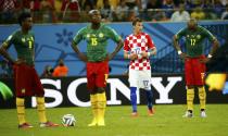 Cameroon's players wait to restart the match after Croatia's Mario Mandzukic (2nd R) scored their team's fourth goal during their 2014 World Cup Group A soccer match at the Amazonia arena in Manaus June 18, 2014. REUTERS/Murad Sezer (BRAZIL - Tags: SOCCER SPORT WORLD CUP)