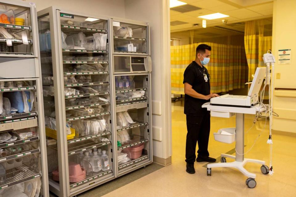 Jorge Gallegos was a Miami firefighter before becoming an emergency room nurse. He’s pictured here working at Baptist Health’s South Miami Hospital in Miami, Florida, on Monday, April 18, 2022.