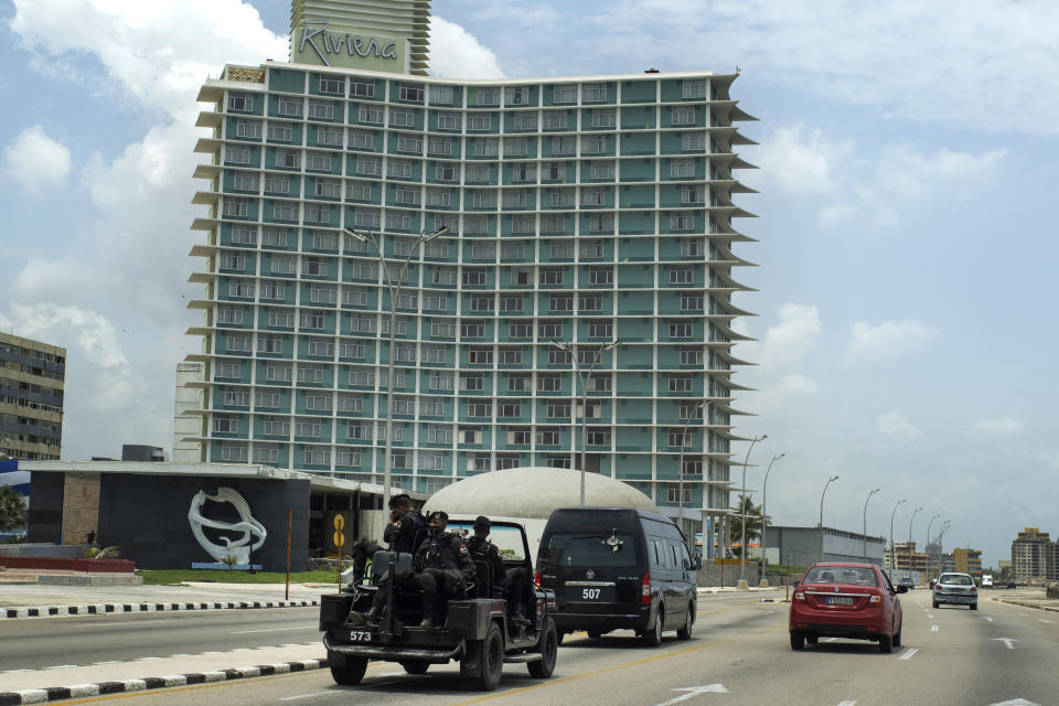 Special forces police patrol past the Riviera hotel in Havana, Cuba, Wednesday, July 14, 2021, days after protests. Demonstrators voiced grievances on Sunday against goods shortages, rising prices and power cuts, and some called for a change of government. (AP Photo/Eliana Aponte)