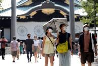 Visitors wearing protective face masks are seen at Yasukuni Shrine for the war dead, amid the coronavirus disease (COVID-19) pandemic, in Tokyo