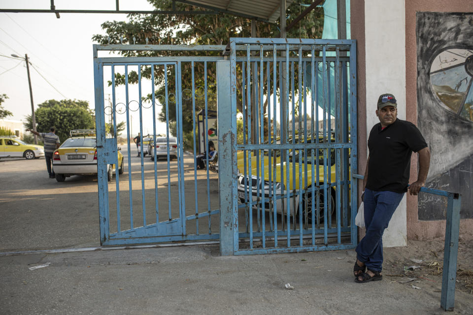 Palestinian Ibrahim Slaieh waits to enter the Erez crossing with Israel on his way to a job in Beersheba, in Beit Hanoun northern Gaza Strip, Sunday, Aug 21, 2022. Since last year, Israel has issued over 15,000 permits allowing Palestinians from the Gaza Strip to work in Israel. Their wages are far higher than those available inside Gaza. With Gaza's economy in freefall, these permits are highly coveted and have given an important economic boost to thousands of families. But even Israel acknowledges the system is a powerful tool to preserve calm or — as critics say — control. (AP Photo/Fatima Shbair)