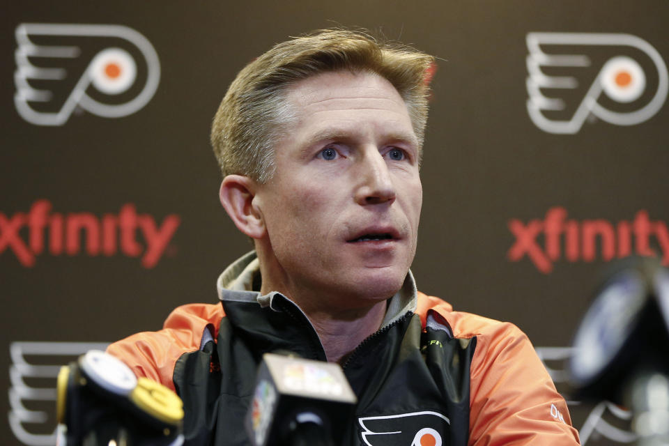 FILE - Philadelphia Flyers head coach Dave Hakstol speaks with members of the media during a news conference in Voorhees, N.J., in this Monday, April 11, 2016, file photo. The Seattle Kraken hired Dave Hakstol on Thursday, June 24, 2021, as head coach of the expansion franchise that will begin its first NHL season in the fall. It’s his second NHL head-coaching job after three plus seasons with the Philadelphia Flyers from 2015-19. (AP Photo/Matt Rourke, File)