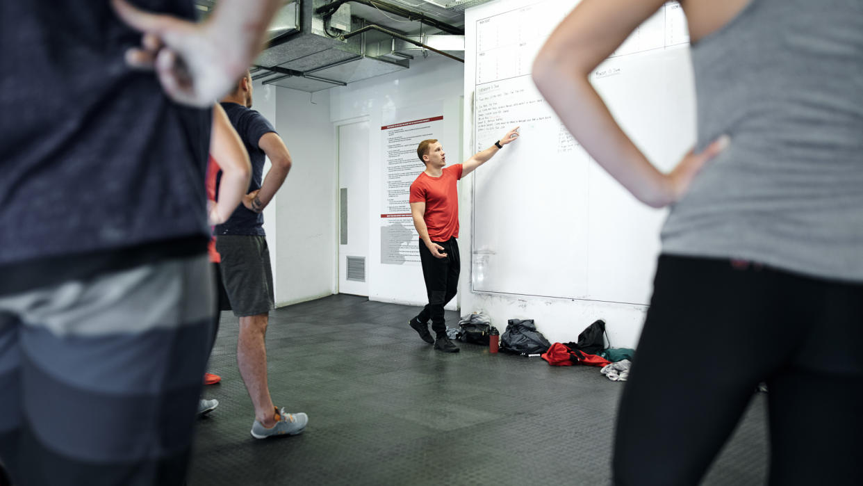 Shot of a fitness instructor working on a fitness program.