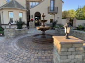 <p> Paving is a great low-maintenance choice for front yard landscaping ideas. However, a full paved front yard can look unimaginative and featureless. Therefore, it's vital to add characterful features to your front yard landscaping ideas.  </p> <p> While water feature ideas are popular for backyards, they are often discounted when it comes to front garden design. However, the right garden fountain ideas can bring height and interest to your front yard as well as creating movement and bringing sound to the space. Consider partnering with a concentric paving design to focus the eye towards your fountain as the centerpiece of your front yard. </p>