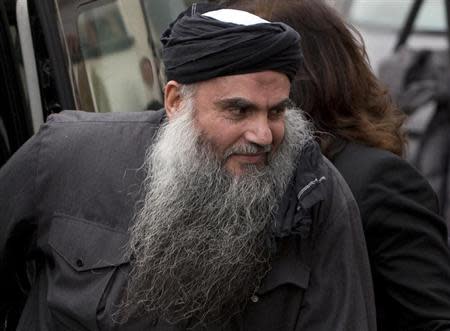 Radical Muslim cleric Abu Qatada is seen arriving back at his home after being released on bail, in London in this November 13, 2012 file photograph. REUTERS/Neil Hall/Files