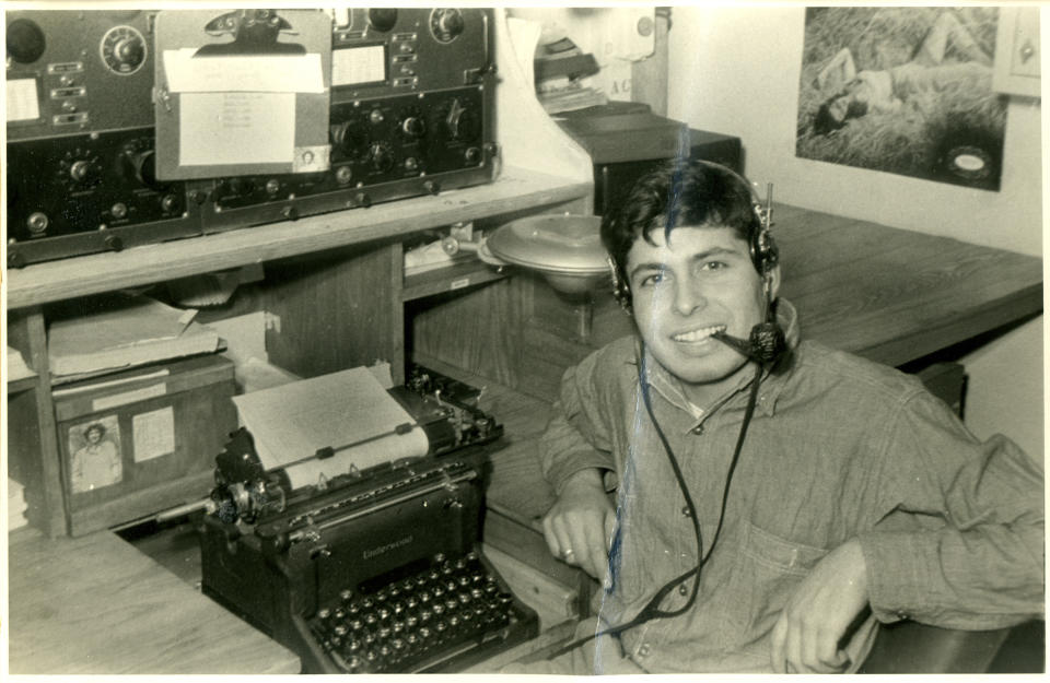 Radioman Peter Orlando sitting behind a typewriter on the recue-tug USS ATR-2. Orlando witnessed the landings at Omaha Beach from his tugboat. | The National WWII Museum