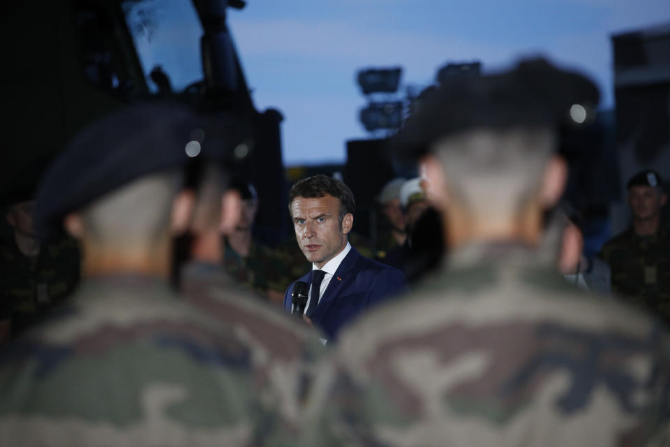 French President Emmanuel Macron speaks to French soldiers at the Mihail Kogalniceanu Air Base, near the city of Constanta, Romania, Tuesday, June 14, 2022. French President Emmanuel Macron is set to hold bilateral talks with officials and meet with French troops who are part of NATO's response to Russia's invasion of Ukraine. France has around 500 soldiers deployed in Romania and has been a key player in NATO's bolstering of forces on the alliance's eastern flank following Russia's invasion on Feb. 24. (Yoan Valat, Pool via AP)