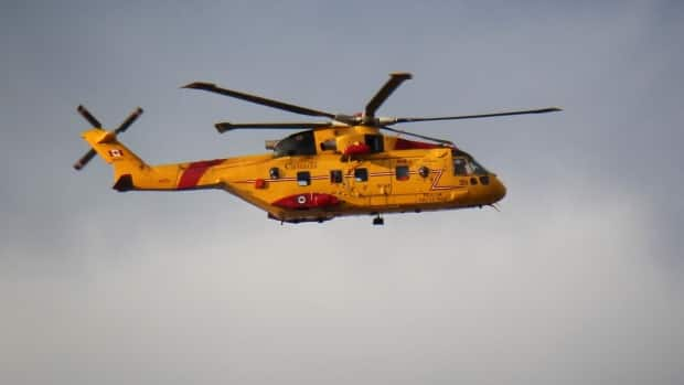 A Cormorant helicopter is pictured in December. A Cormorant is part of the search for one of five people from the FV Tyhawk fishing vessel off the coast of Cape Breton, according to a spokesperson for the Join Rescue Coordination Centre. (Brett Ruskin/CBC - image credit)